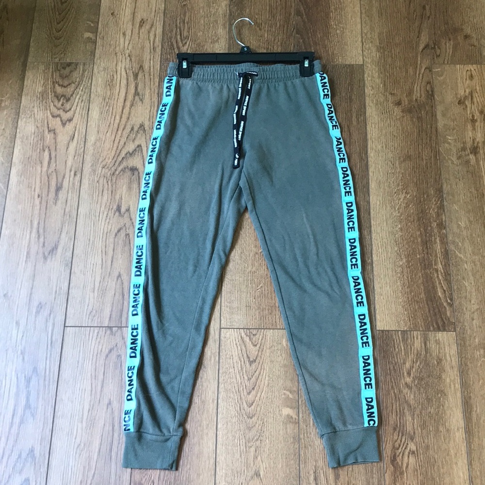 Justice sweatpants with the word dance across the side of the leg